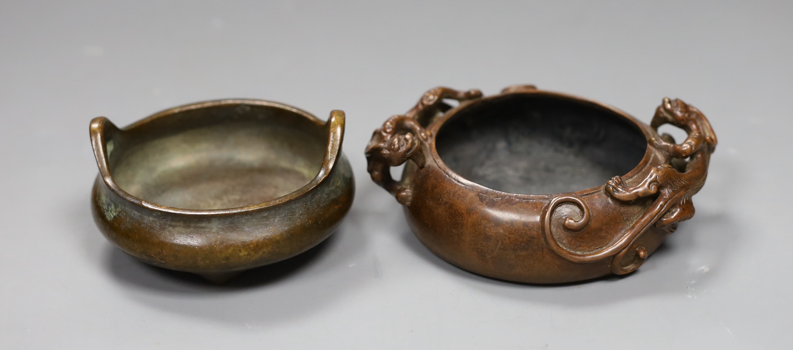 Two Chinese bronze censers, largest 11cms diameter